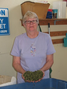 Sharon McClennan holding a handful of spinach