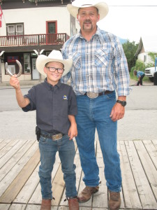 Jay St. Germaine (Stirling Creek Ranch) & great nephew handing out horseshoes
