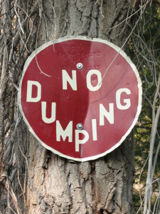 Sign painted on lid of dumped cyanide container.