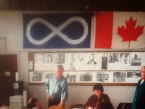 Harvey Donahue with Metis flag in the background