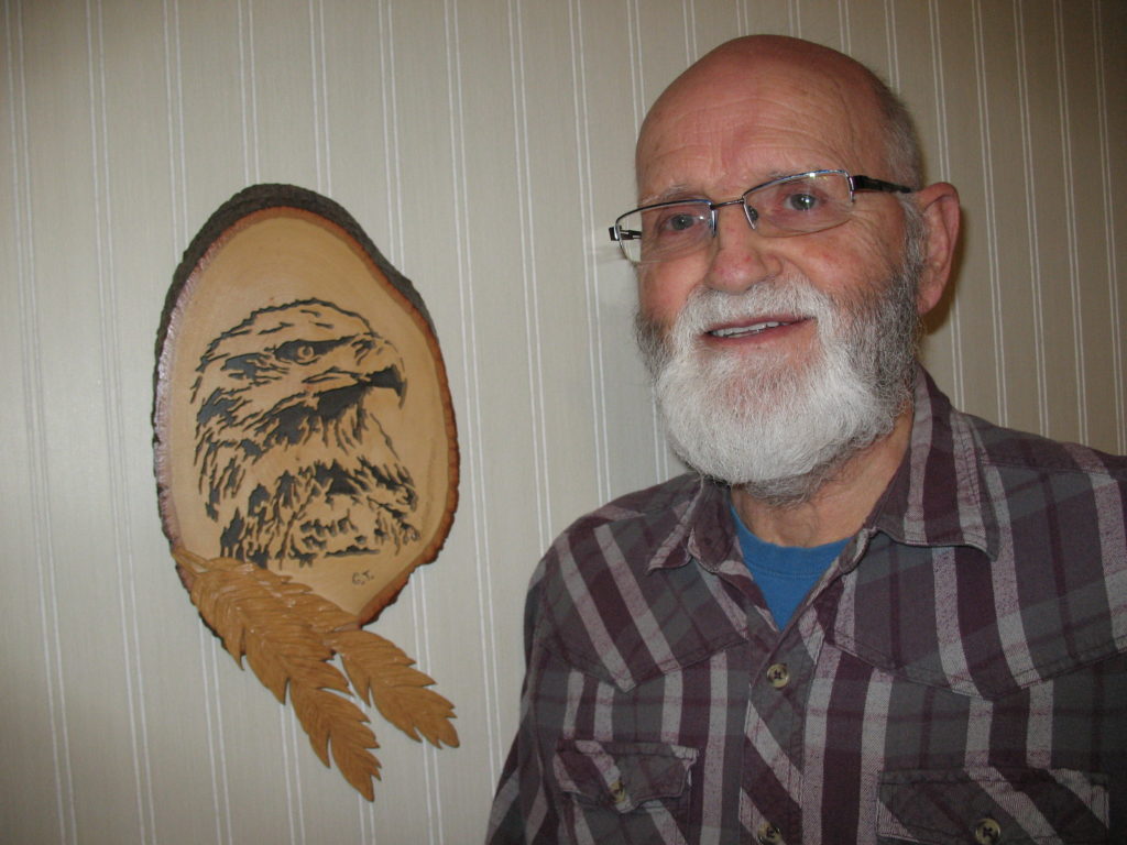 George with one of his wood creations.