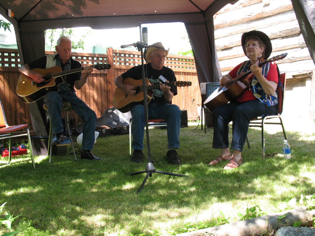 Harold Tuck, George Huber and Colleen Cox playing Bluegrass music.
